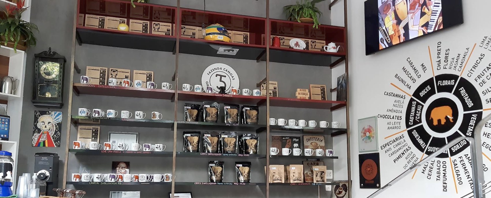 The retail wall of branded elephant mugs and coffee bags at Intelligenza